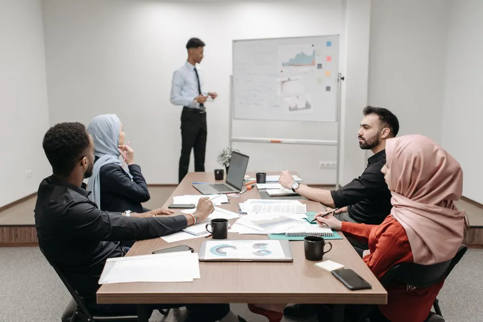 Professionals collaborating during a meeting in a modern office