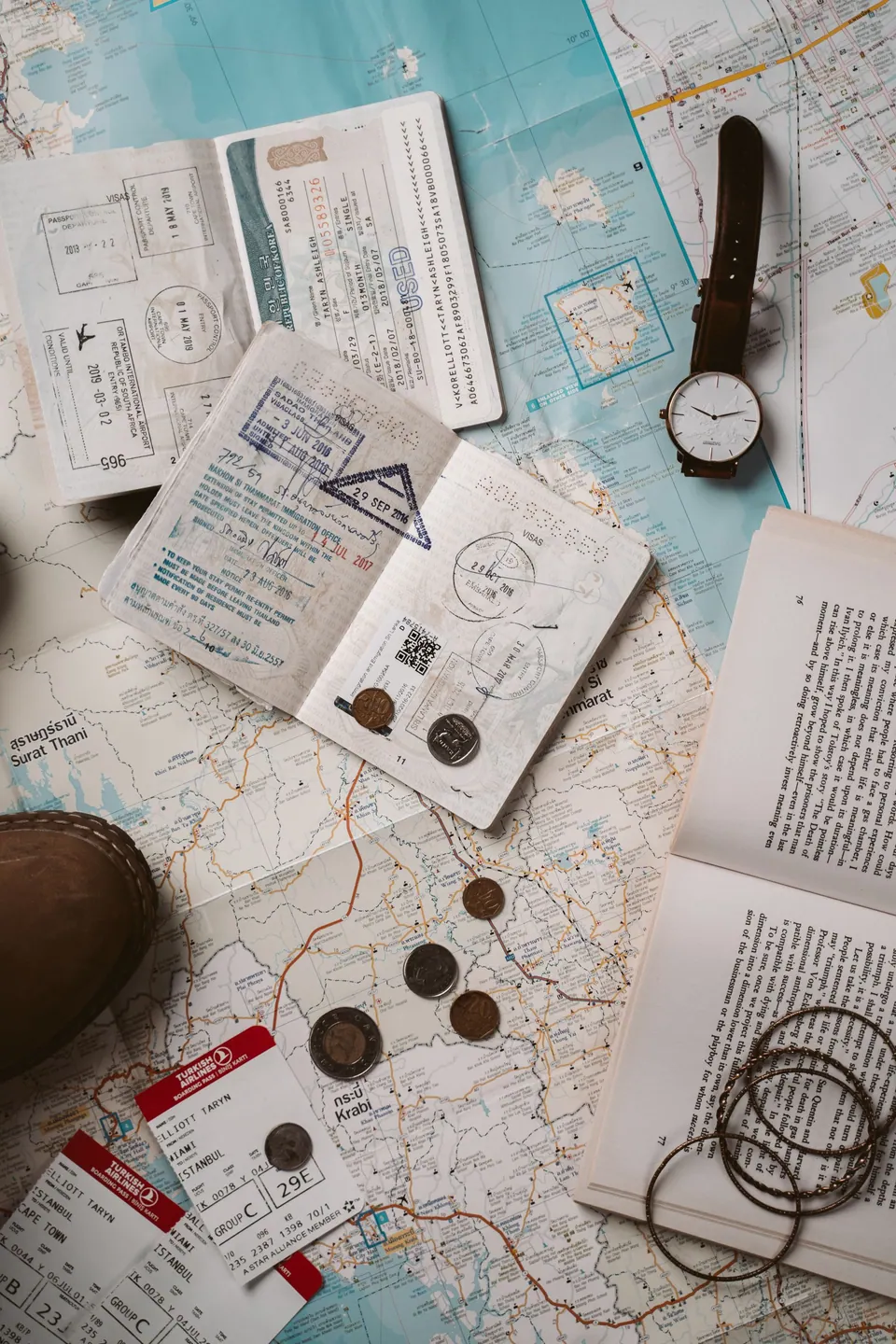 Travel documents and a map arranged on a table